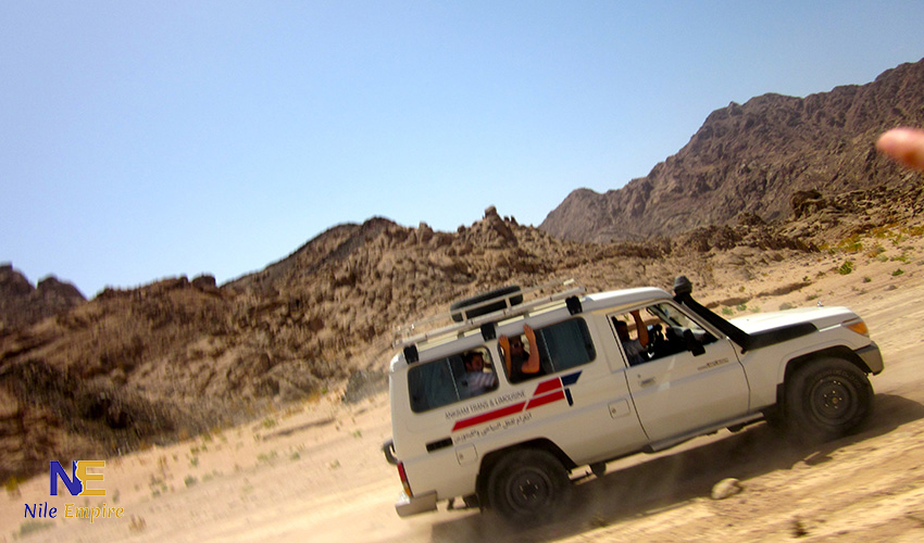 Tourist riding an ATV during a fast-paced Hurghada quad biking desert safari in the Eastern Desert