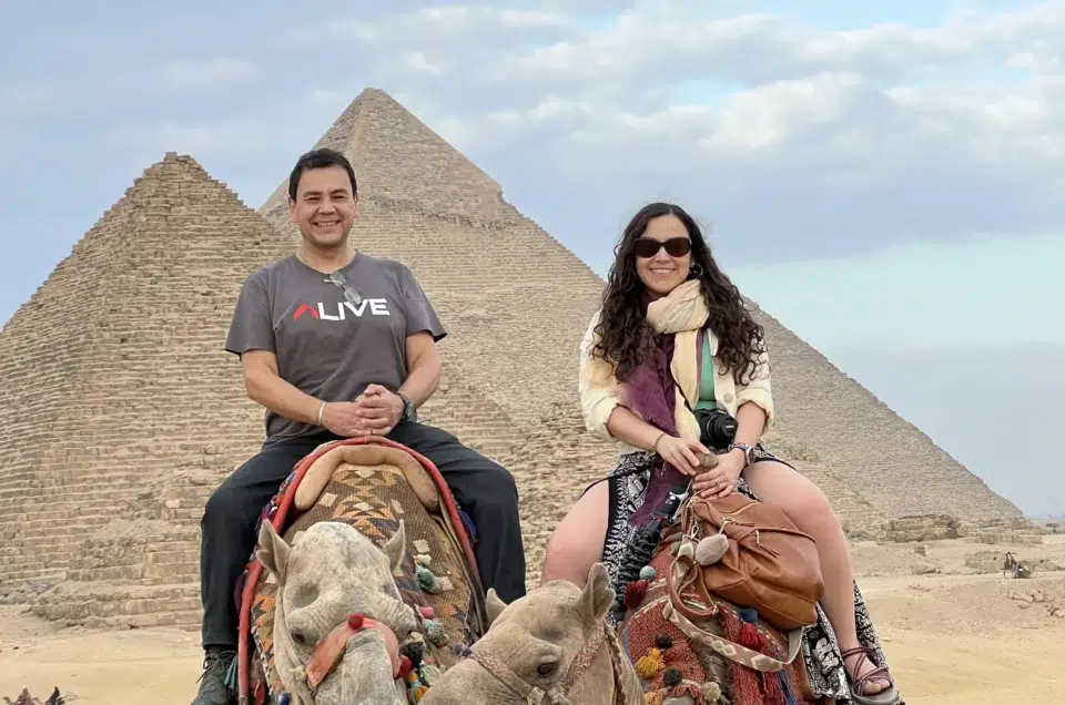 camel ride giza pyramids egypt tourists
